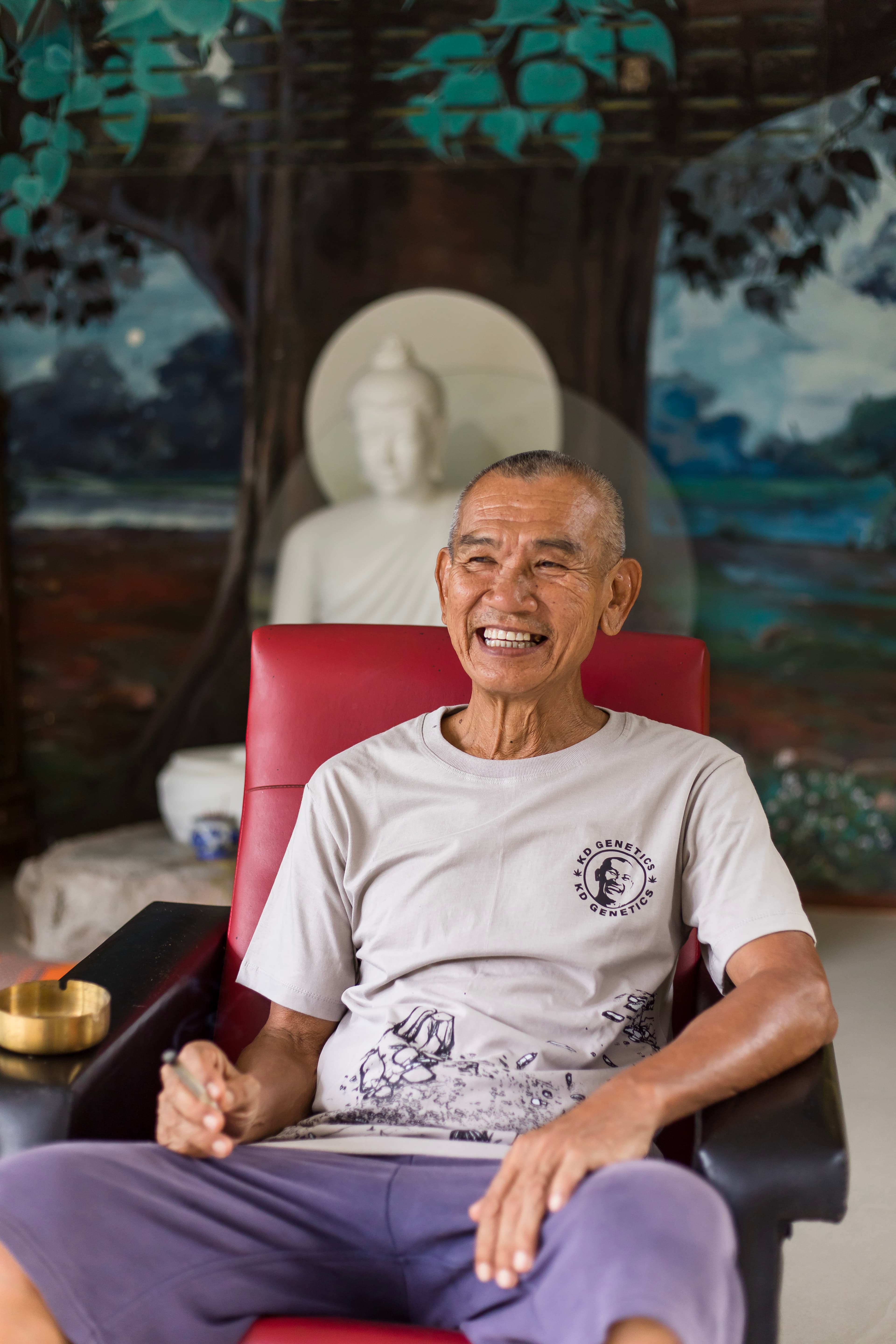Papa KD at home, smiling — the heart of the farm